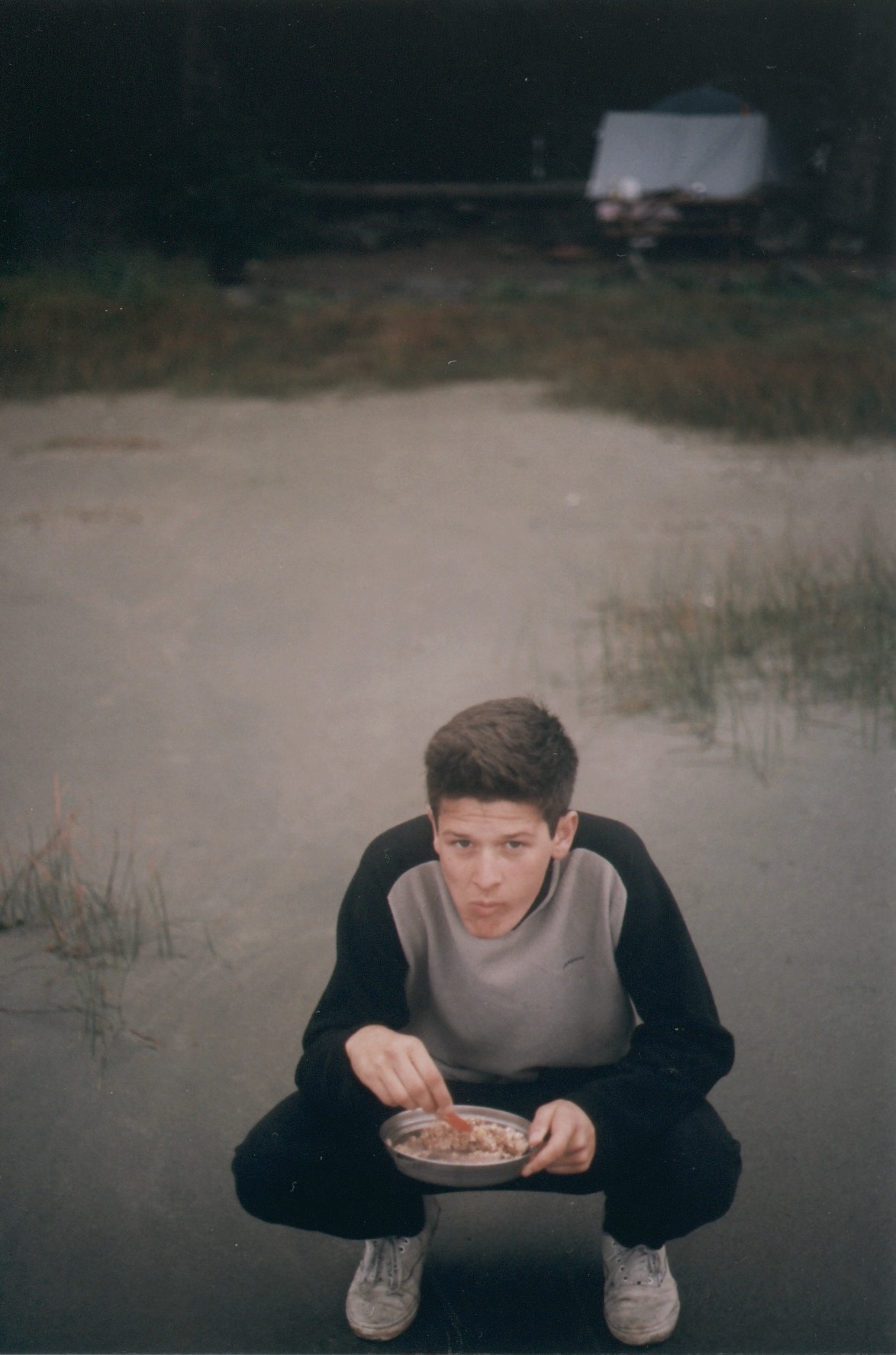 hamish eating breakfast on the beach in tofino