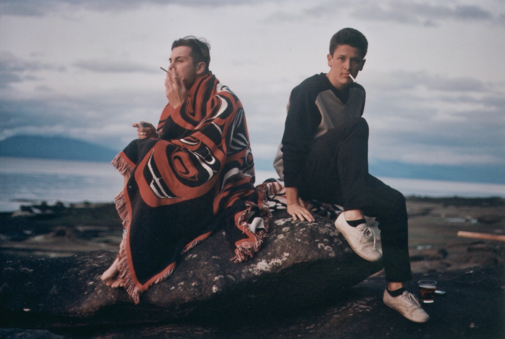 hamish and raffi sitting on a rock