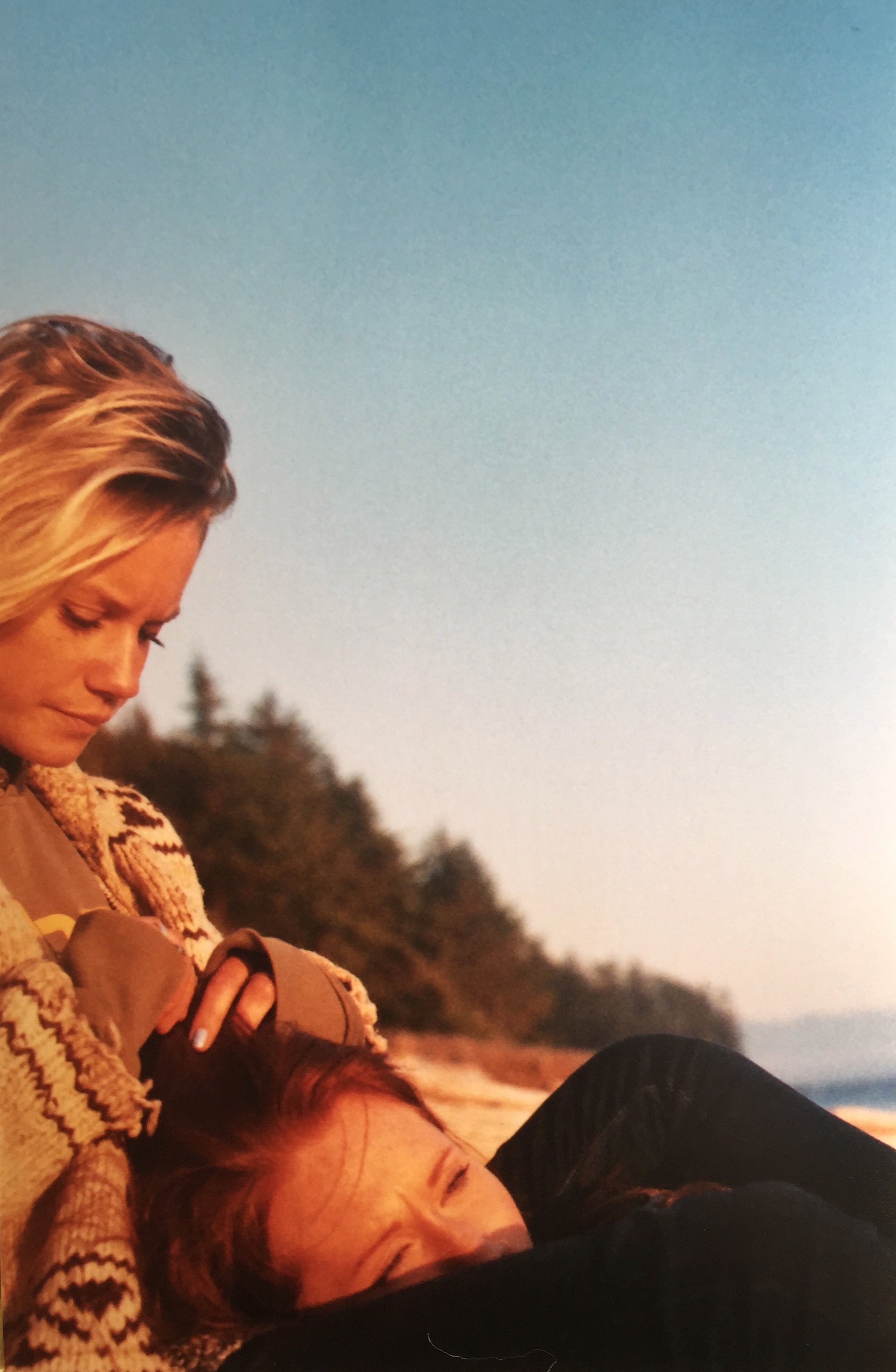 margo and savanna lying down on the beach