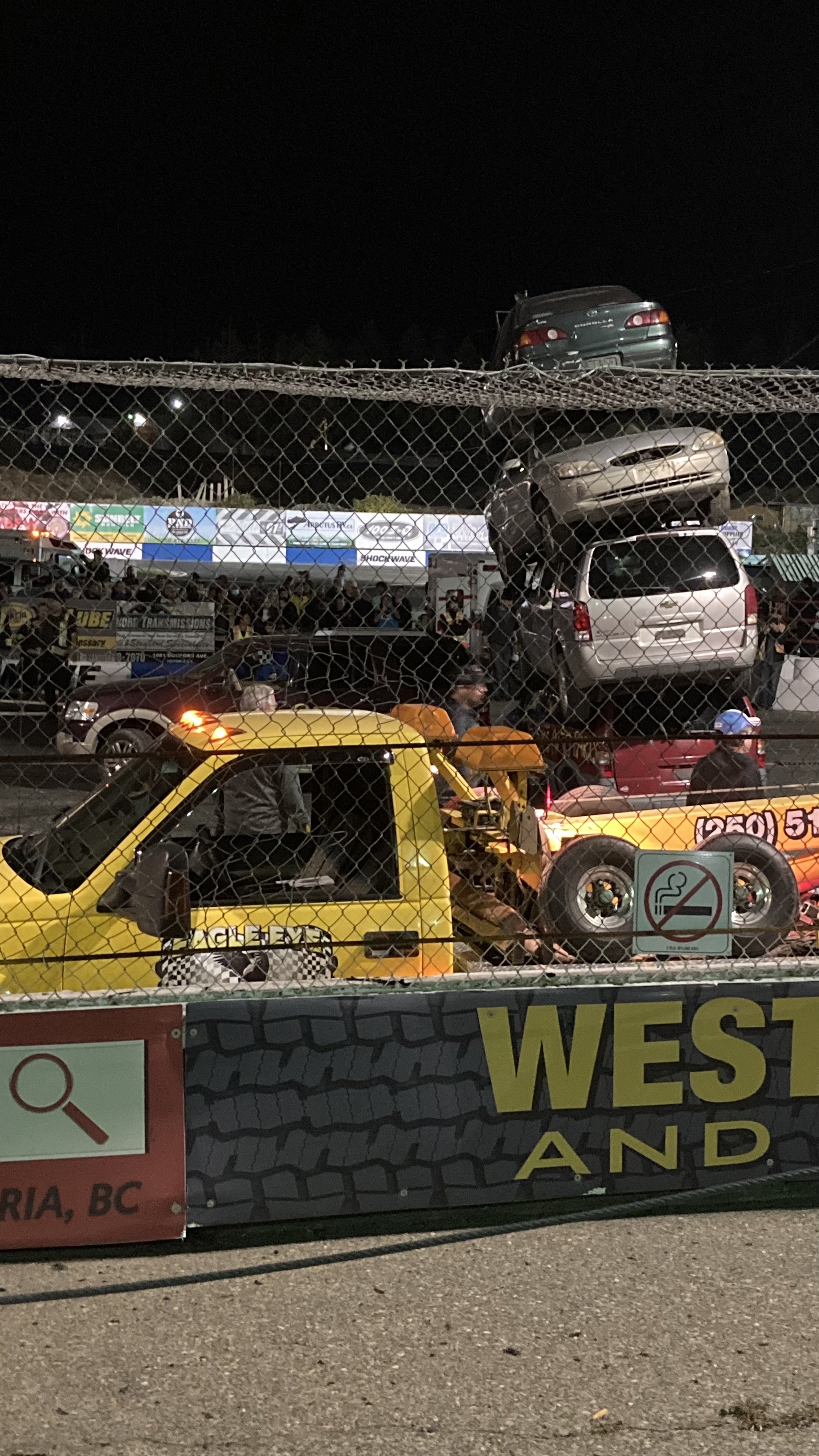 cars are piled on top of each other at a speedway in langford, british columbia