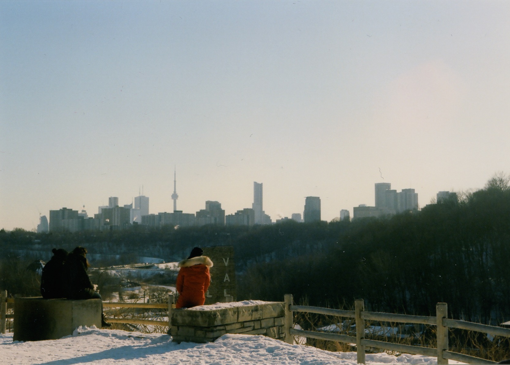 people sitting and looking at the toronto skyline from evergreen brickworks